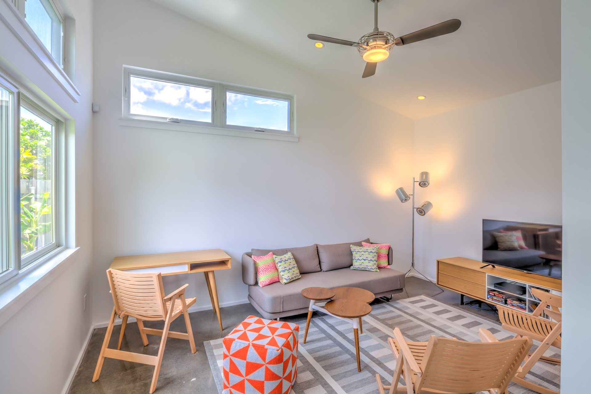 Bright interior of Hale Kilo Ia with high ceilings and large openings